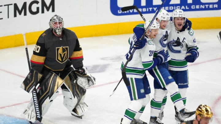Apr 6, 2022; Las Vegas, Nevada, USA; Vancouver Canucks center Elias Pettersson (40) celebrates with Vancouver Canucks right wing Alex Chiasson (39) and Vancouver Canucks center Bo Horvat (53) after scoring a goal against Vegas Golden Knights goaltender Robin Lehner (90) during the third period at T-Mobile Arena. Mandatory Credit: Stephen R. Sylvanie-USA TODAY Sports