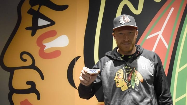 Oct 18, 2016; Chicago, IL, USA; Chicago Blackhawks right wing Marian Hossa (81) poses for a photo with the puck he scored his 500th goal with against Philadelphia Flyers at the United Center. The Hawks won 7-4. Mandatory Credit: David Banks-USA TODAY Sports