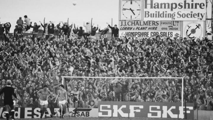 Fans in the terraces watching a Portsmouth v Southampton match at Fratton Park, Portsmouth, UK, 30th January 1984. (Photo by Reg Lancaster/Daily Express/Hulton Archive/Getty Images)