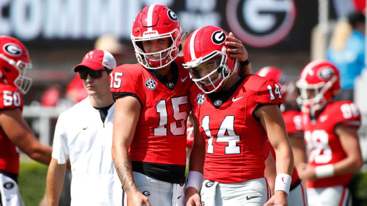 Georgia quarterback Carson Beck (15) and Georgia quarterback Gunner Stockton (14) get ready before the start of a NCAA college football game against Ball State in Athens, Ga., on Saturday, Sept. 9, 2023.