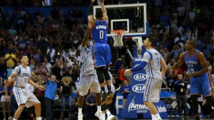 Oct 30, 2015; Orlando, FL, USA; Oklahoma City Thunder guard Russell Westbrook (0) shoots a three from midcourt to force the game to go into overtime against the Orlando Magic during the last seconds of the fourth quarter at Amway Center. Oklahoma City Thunder defeated the Orlando Magic 139-136 in double overtime. Mandatory Credit: Kim Klement-USA TODAY Sports