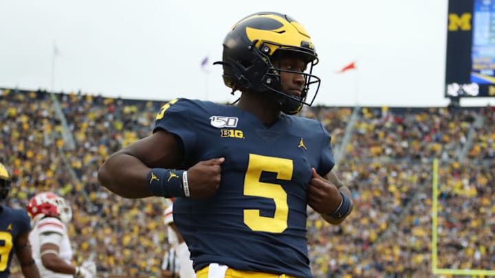 ANN ARBOR, MICHIGAN - SEPTEMBER 28: Joe Milton #5 of the Michigan Wolverines scores a fourth quarter touchdown while playing the Rutgers Scarlet Knights at Michigan Stadium on September 28, 2019 in Ann Arbor, Michigan. (Photo by Gregory Shamus/Getty Images)