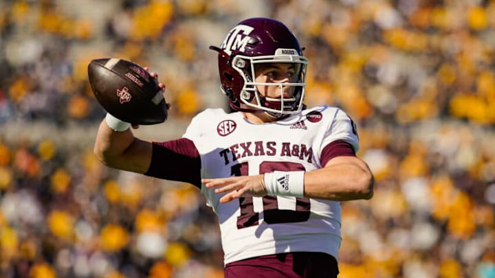 Oct 16, 2021; Columbia, Missouri, USA; Texas A&M Aggies quarterback Zach Calzada (10) warms up during a timeout in the first half against the Missouri Tigers at Faurot Field at Memorial Stadium. Mandatory Credit: Jay Biggerstaff-USA TODAY Sports