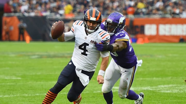 CHICAGO, ILLINOIS - SEPTEMBER 29: Chase Daniel #4 of the Chicago Bears is brought down by Danielle Hunter #99 of the Minnesota Vikings during the first half at Soldier Field on September 29, 2019 in Chicago, Illinois. (Photo by Stacy Revere/Getty Images)