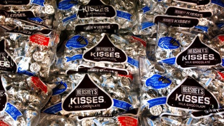 HERSHEY, PA - AUGUST 7: Bags of Hershey Kisses sit on a shelf at a store on August 7, 2002 in Hershey, Pennsylvania. The Hershey Trust said Wednesday after a special meeting of its board that it will continue to explore selling the company despite criticism from the state's political and business leaders. (Photo by Spencer Platt/Getty Images)