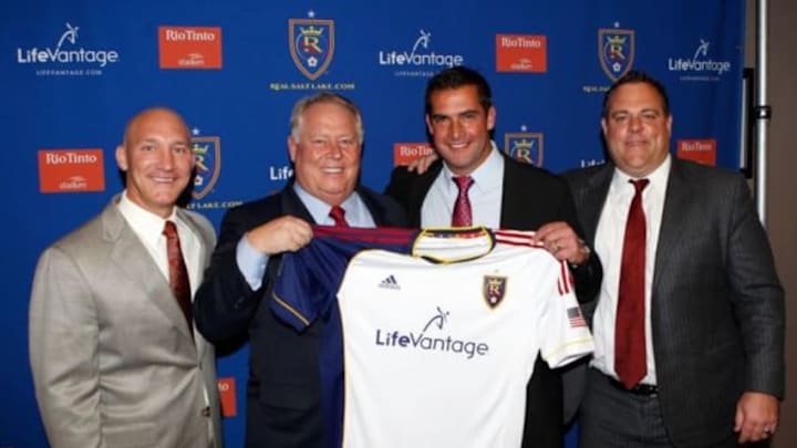 Dec 19, 2013; Salt Lake City, UT, USA; From left Real Salt Lake president Bill Manning , owner Dell Loy Hansen , head coach Jeff Cassar and general manager Garth Lagerway pose for a photo with a jersey during a press conference at Rio Tinto Stadium. Mandatory Credit: Chris Nicoll-USA TODAY Sports