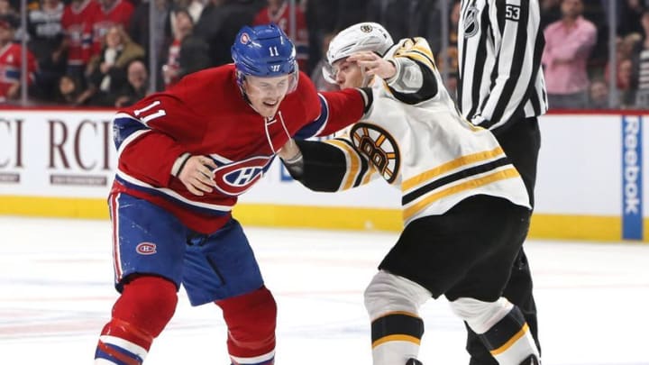 Dec 12, 2016; Montreal, Quebec, CAN; Boston Bruins defenseman Torey Krug (47) and Montreal Canadiens right wing Brendan Gallagher (11) fight during the first period at Bell Centre. Mandatory Credit: Jean-Yves Ahern-USA TODAY Sports