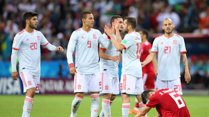KAZAN, RUSSIA - JUNE 20: Spain players celebrate whilst Saeid Ezatolahi of Iran looks dejected after his sides defeat in the 2018 FIFA World Cup Russia group B match between Iran and Spain at Kazan Arena on June 20, 2018 in Kazan, Russia. (Photo by Alex Livesey/Getty Images)