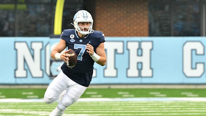 CHAPEL HILL, NORTH CAROLINA – OCTOBER 10: Sam Howell #7 of the North Carolina Tar Heels rolls out against the Virginia Tech Hokies during their game at Kenan Stadium on October 10, 2020 in Chapel Hill, North Carolina. North Carolina won 56-45. (Photo by Grant Halverson/Getty Images)