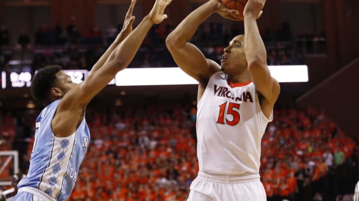 Feb 27, 2016; Charlottesville, VA, USA; Virginia Cavaliers guard Malcolm Brogdon (15) shoots the ball over North Carolina Tar Heels guard Nate Britt (0) in the second half at John Paul Jones Arena. The Cavaliers won 79-74. Mandatory Credit: Geoff Burke-USA TODAY Sports