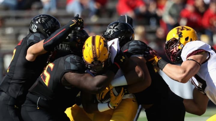COLLEGE PARK, MD - OCTOBER 15: Rodney Smith #1 of the Minnesota Golden Gophers is gang tackled by the Maryland Terrapins defense in the first half at Capital One Field on October 15, 2016 in College Park, Maryland. (Photo by Rob Carr/Getty Images)