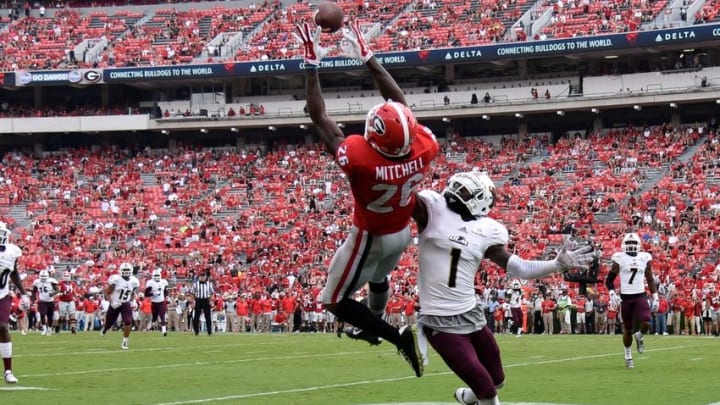 Sep 5, 2015; Athens, GA, USA; Georgia Bulldogs wide receiver Malcolm Mitchell (26) catches a touchdown pass defended by Louisiana Monroe Warhawks cornerback Lenzy Pipkins (1) during the second half at Sanford Stadium. Georgia defeated Louisiana Monroe 51-14 in a game shortened by thunder storms. Mandatory Credit: Dale Zanine-USA TODAY Sports