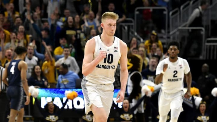 MILWAUKEE, WISCONSIN - MARCH 09: Sam Hauser #10 of the Marquette Golden Eagles reacts after making a three point basket to end the first half against the Georgetown Hoyas at Fiserv Forum on March 09, 2019 in Milwaukee, Wisconsin. (Photo by Quinn Harris/Getty Images)
