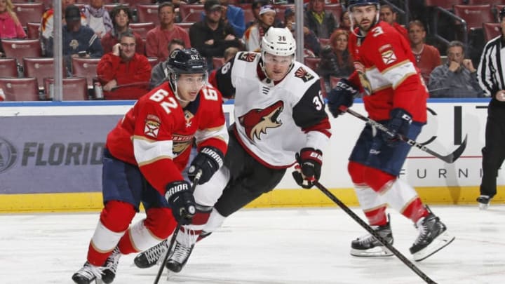SUNRISE, FL - JANUARY 7: Christian Fischer #36 of the Arizona Coyotes defends against Denis Malgin #62 of the Florida Panthers at the BB&T Center on January 7, 2020 in Sunrise, Florida. The Coyotes defeated the Panthers 5-2. (Photo by Joel Auerbach/Getty Images)