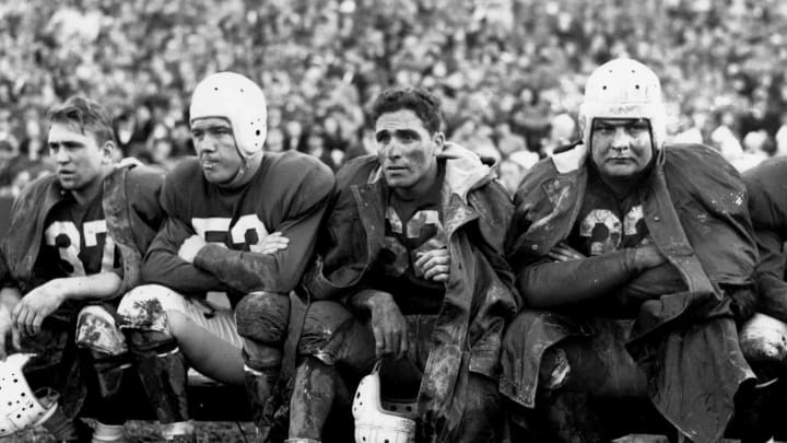 Halfback Charley Trippi of the Chicago Cardinals along with Vic Schwall(37), Bill Campbell(53), and Vince Banonis(32) on the bench during a 45 to 21 loss to the Washington Redskins on November 23, 1947 at Griffith Stadium in Washington, DC. (Photo by Nate Fine/Getty Images)