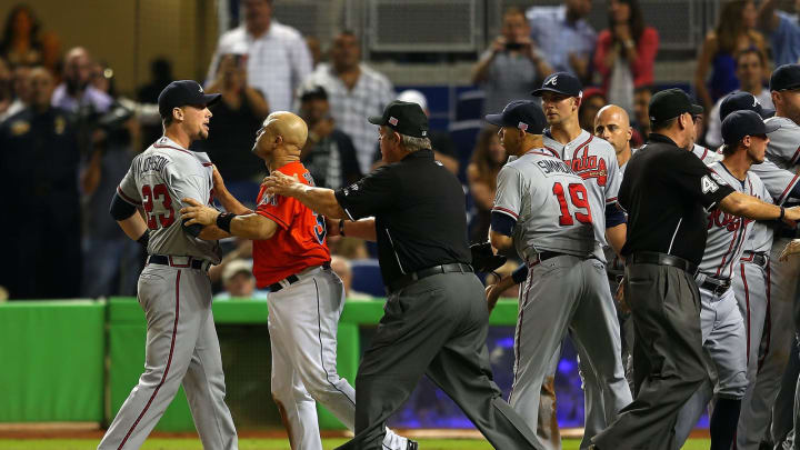 MIAMI, FL – SEPTEMBER 11: Chris Johnson #23 of the Atlanta Braves is held back during a scuffle after a solo home run by Jose Fernandez #16 of the Miami Marlins (not pictured) during a game at Marlins Park on September 11, 2013 in Miami, Florida. (Photo by Mike Ehrmann/Getty Images)