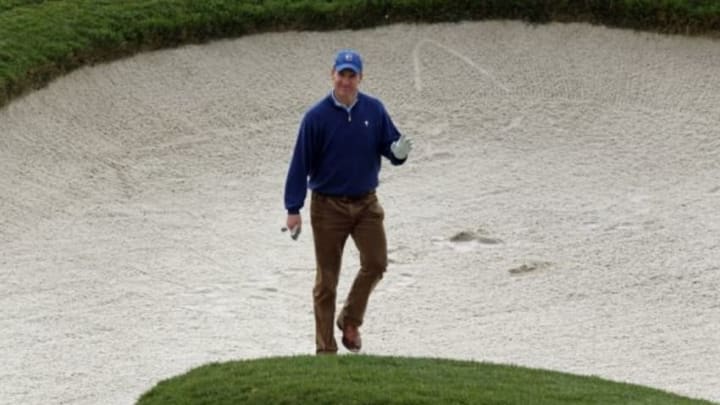 Feb 7, 2014; Pebble Beach, CA, USA; NFL quarterback Peyton Manning thanks the galley for their warm support after hitting out of the sand trap on the 7th hole at Pebble Beach Golf Links during the second round of the AT&T National Pro-Am at Pebble Beach Calif. Mandatory Credit: Lance Iversen-USA TODAY Sports