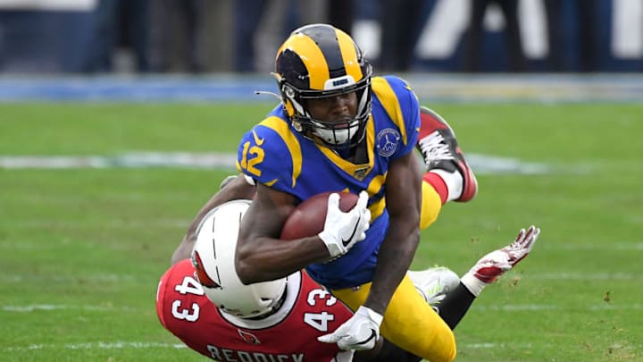 LOS ANGELES, CA - DECEMBER 29: Wide receiver Brandin Cooks #12 of the Los Angeles Rams hangs on to a complete pass before he is stopped by outside linebacker Haason Reddick #43 of the Arizona Cardinals in the second half of the game at the Los Angeles Memorial Coliseum on December 29, 2019 in Los Angeles, California. (Photo by Jayne Kamin-Oncea/Getty Images)
