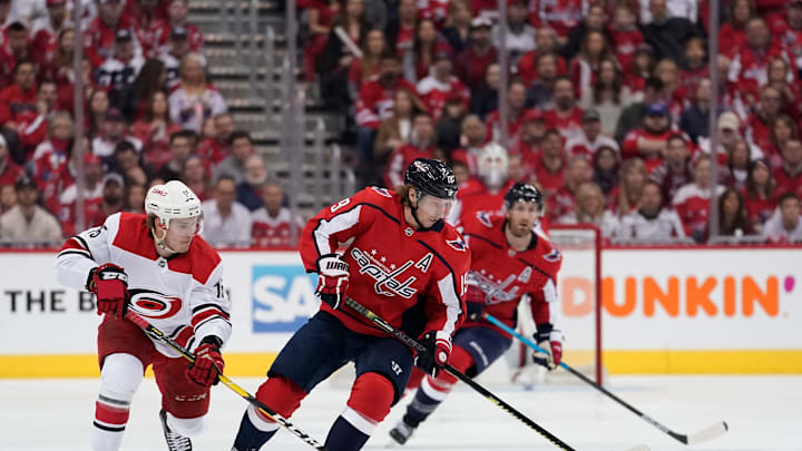 WASHINGTON, DC – APRIL 20: Nicklas Backstrom #19 of the Washington Capitals and Aleksi Saarela #15 of the Carolina Hurricanes skate after the puck in the first period in Game Five of the Eastern Conference First Round during the 2019 NHL Stanley Cup Playoffs at Capital One Arena on April 20, 2019 in Washington, DC. (Photo by Patrick McDermott/NHLI via Getty Images)