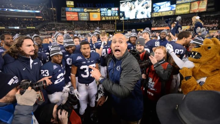 Dec 27, 2014; Bronx, NY, USA; Penn State Nittany Lions head coach James Franklin celebrates with players after overtime of the 2014 Pinstripe Bowl against the Boston College Eagles at Yankee Stadium. Penn State won 31-30 in overtime Mandatory Credit: Joe Camporeale-USA TODAY Sports