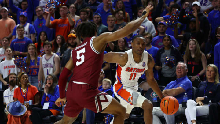 Jan 25, 2023; Gainesville, Florida, USA; Florida Gators guard Kyle Lofton (11) drives to the basket against South Carolina Gamecocks guard Meechie Johnson (5) during the second half at Exactech Arena at the Stephen C. O'Connell Center. Mandatory Credit: Kim Klement-USA TODAY Sports