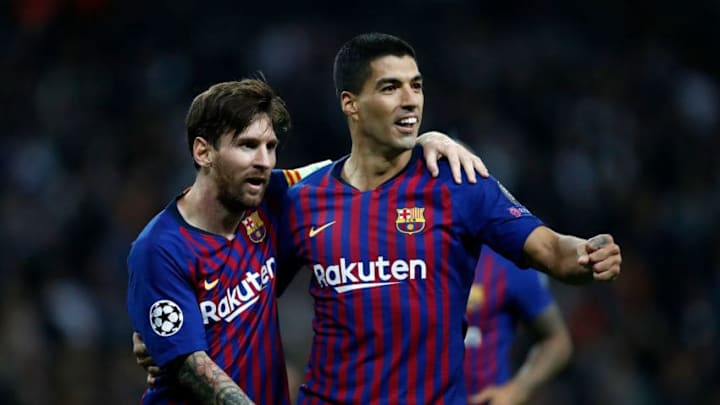 LONDON, ENGLAND - OCTOBER 03: Lionel Messi of Barcelona celebrates scoring his teams fourth goal with Luis Suarez during the Group B match of the UEFA Champions League between Tottenham Hotspur and FC Barcelona at Wembley Stadium on October 3, 2018 in London, United Kingdom. (Photo by Julian Finney/Getty Images)