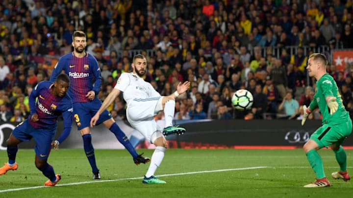 BARCELONA, SPAIN - MAY 06: Karim Benzema of Real Madrid shoots as Marc-Andre ter Stegen of Barcelona attempts to save during the La Liga match between Barcelona and Real Madrid at Camp Nou on May 6, 2018 in Barcelona, Spain. (Photo by Alex Caparros/Getty Images)