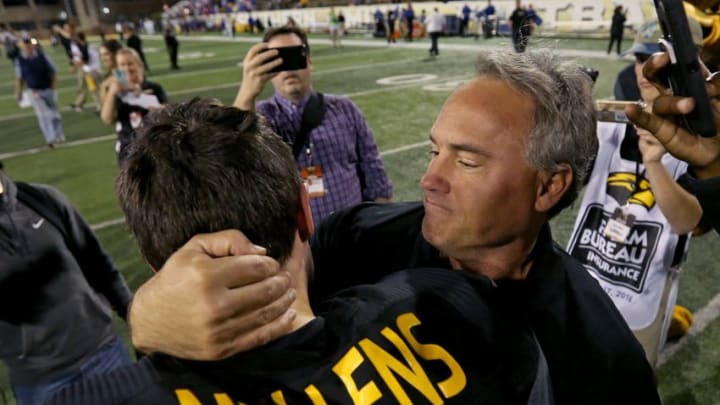 Nov 25, 2016; Hattiesburg, MS, USA; Southern Miss Golden Eagles head coach Jay Hopson hugs quarterback Nick Mullens (9) after their game against the Louisiana Tech Bulldogs at M.M. Roberts Stadium. Southern Miss won, 39-24. Mandatory Credit: Chuck Cook-USA TODAY Sports