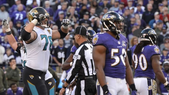 Nov 15, 2015; Baltimore, MD, USA; Jacksonville Jaguars tackle Luke Joeckel (76) celebrates after kicker Jason Myers (2) (not pictured) game winning field goal as time expired in the fourth quarter against the Baltimore Ravens at M&T Bank Stadium. Jacksonville Jaguars defeated Baltimore Ravens 22-20. Mandatory Credit: Tommy Gilligan-USA TODAY Sports