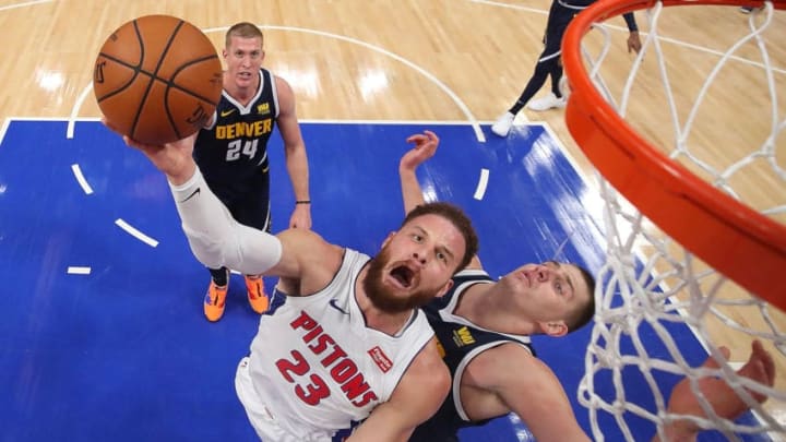 DETROIT, MICHIGAN - FEBRUARY 04: Blake Griffin #23 of the Detroit Pistons tries to get a shot off around Nikola Jokic #15 of the Denver Nuggets during the first half at Little Caesars Arena on February 04, 2019 in Detroit, Michigan. NOTE TO USER: User expressly acknowledges and agrees that, by downloading and or using this photograph, User is consenting to the terms and conditions of the Getty Images License Agreement. (Photo by Gregory Shamus/Getty Images)