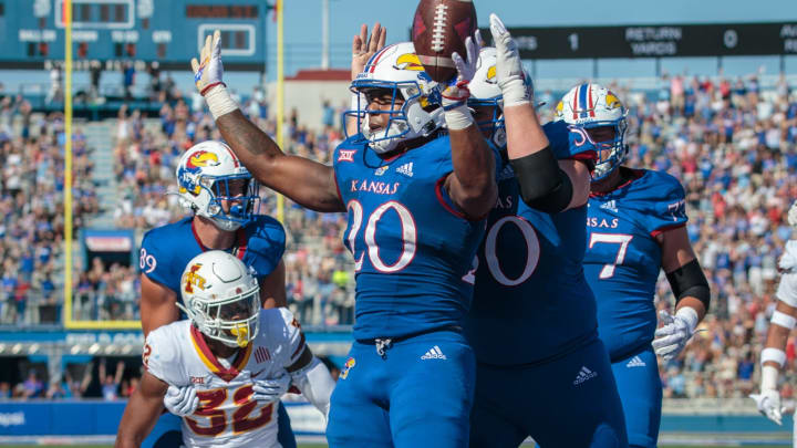 Oct 1, 2022; Lawrence, Kansas, USA; Kansas Jayhawks running back Daniel Hishaw Jr. (20) celebrates in the end zone after a touch down during the second quarter against the Iowa State Cyclones at David Booth Kansas Memorial Stadium. Mandatory Credit: William Purnell-USA TODAY Sports