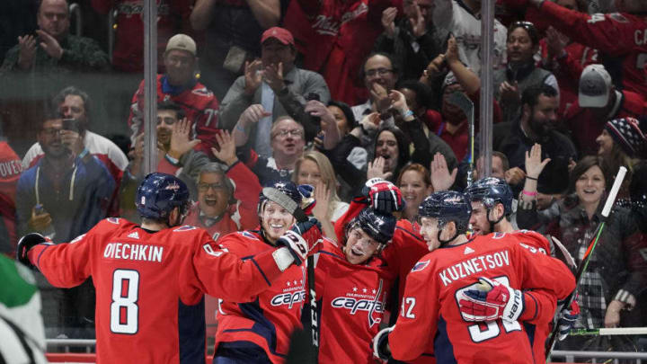 WASHINGTON, DC - OCTOBER 08: Nicklas Backstrom #19 of the Washington Capitals celebrates with his teammates after scoring a goal in the third period against the Dallas Stars at Capital One Arena on October 8, 2019 in Washington, DC. (Photo by Patrick McDermott/NHLI via Getty Images)