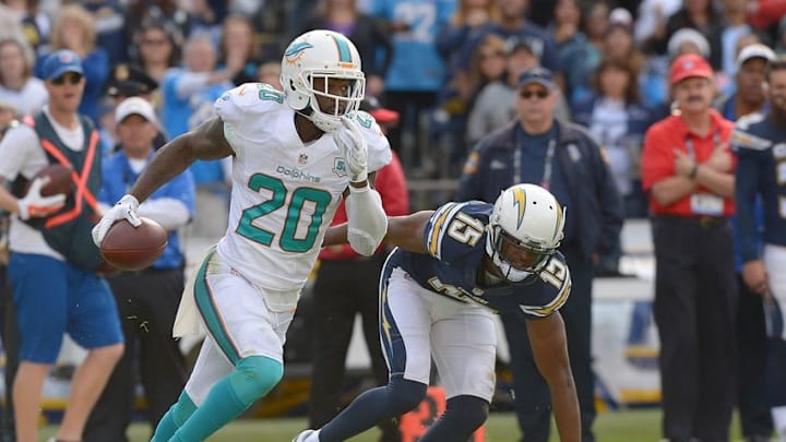 Dec 20, 2015; San Diego, CA, USA; San Diego Chargers wide receiver Dontrelle Inman (15) chases down Miami Dolphins strong safety Reshad Jones (20) after an interception in the second half of the game at Qualcomm Stadium. Mandatory Credit: Jayne Kamin-Oncea-USA TODAY Sports