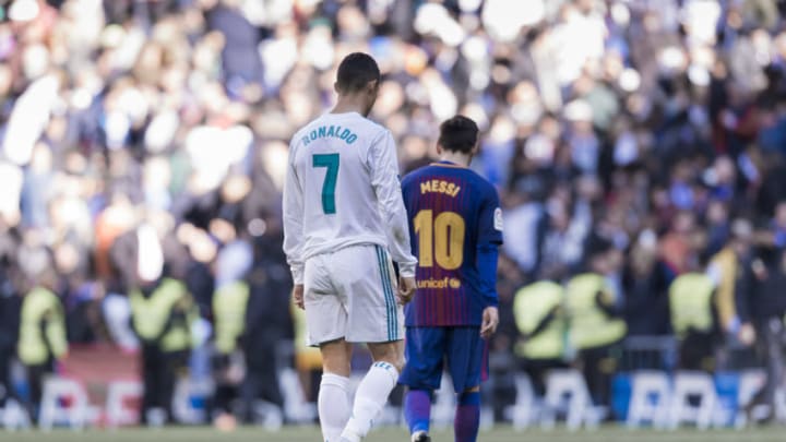 MADRID, SPAIN - DECEMBER 23: Lionel Messi of FC Barcelona and Cristiano Ronaldo of Real Madrid walk off pitch during La Liga match between Real Madrid and FC Barcelona at Santiago Bernabeu stadium on December 23, 2017 in Madrid, Spain. (Photo by Power Sport Images/Getty Images)