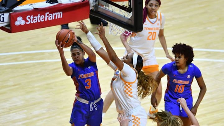 Florida's Lavender Briggs (3) gets the rebound over Tennessee's Kasiyahna Kushkituah (11) during an NCAA women's basketball game between the Tennessee Lady Vols and the Florida Gators in Knoxville, Tenn. on Sunday, January 31, 2021.Kns Ladyvols Florida