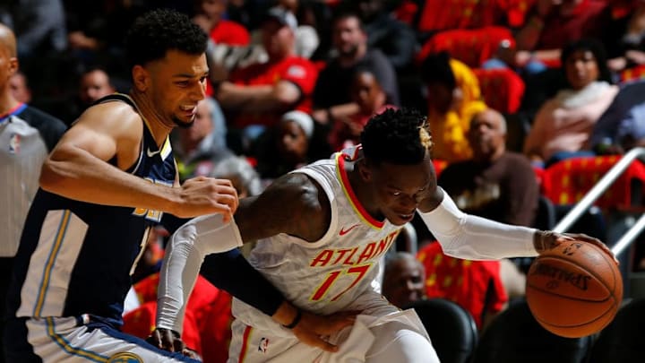 ATLANTA, GA - OCTOBER 27: Dennis Schroder #17 of the Atlanta Hawks drives against Jamal Murray #27 of the Denver Nuggets at Philips Arena on October 27, 2017 in Atlanta, Georgia. NOTE TO USER: User expressly acknowledges and agrees that, by downloading and or using this photograph, User is consenting to the terms and conditions of the Getty Images License Agreement. (Photo by Kevin C. Cox/Getty Images)