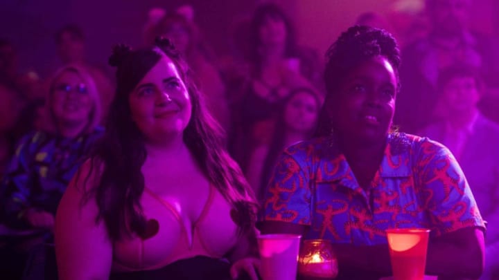 SHRILL -- "Kevin" - Episode 202 - Annie starts her freelance career by interviewing the Troll. Fran is heartbroken after she finds out Vic is not exclusive. When no one reads AnnieÕs article, she realizes going freelance may not be as positive a move as she thought when she quit The Thorn. Annie (Aidy Bryant) and Fran (Lolly Adefope), shown. (Photo by: Allyson Riggs/Hulu)