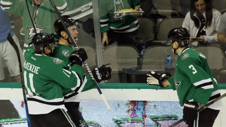 Dec 17, 2016; Dallas, TX, USA; Dallas Stars right wing Adam Cracknell (27) celebrates scoring the game-winning goal with left wing Curtis McKenzie (11) in the third period at American Airlines Center. Stars won 3-1. Mandatory Credit: Tim Heitman-USA TODAY Sports