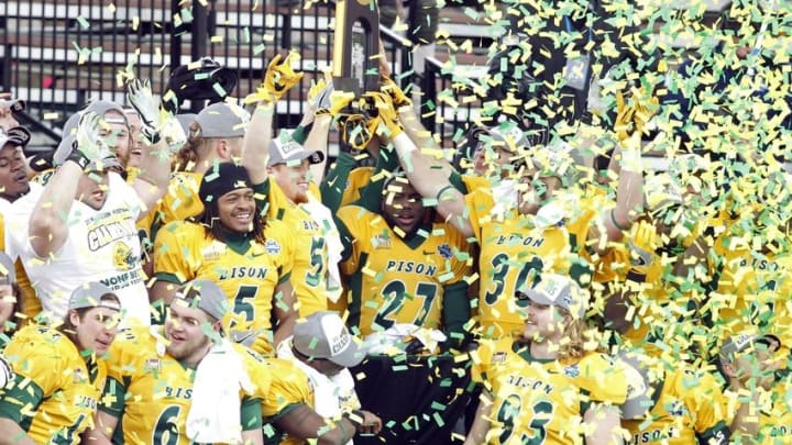 Jan 9, 2016; Frisco, TX, USA; North Dakota State Bison players hold up the championship trophy after the game against the Jacksonville State Gamecocks in the FCS Championship college football game at Toyota Stadium. North Dakota State won the championship 37-10. Mandatory Credit: Tim Heitman-USA TODAY Sports