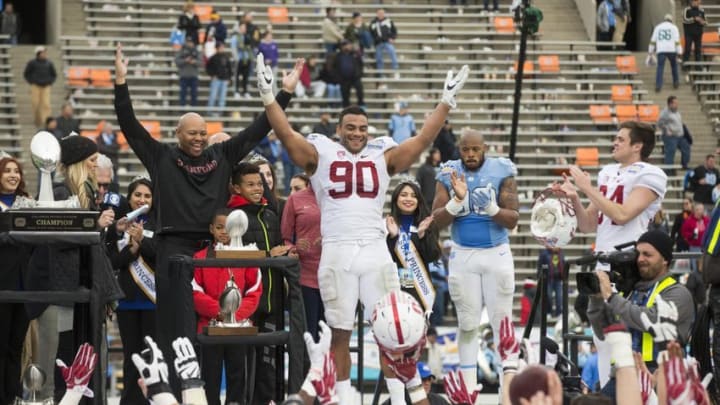Dec 30, 2016; El Paso, TX, USA; Stanford Cardinal defensive lineman Solomon Thomas (90) celebrates with head coach David Shaw (L) after defeating the North Carolina Tar Heels 25-23 at Sun Bowl Stadium. Thomas was named MVP of the game. Mandatory Credit: Ivan Pierre Aguirre-USA TODAY Sports