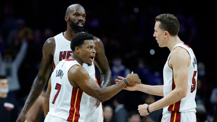 Kyle Lowry #7, Dewayne Dedmon #21 and Duncan Robinson #55 of the Miami Heat celebrate(Photo by Tim Nwachukwu/Getty Images)