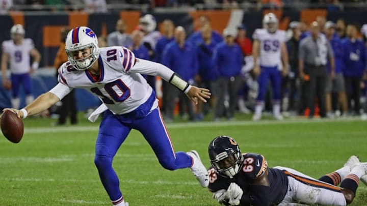 CHICAGO, IL - AUGUST 30: AJ McCarron #10 of the Buffalo Bills breaks away from Ro'Derrick Hoskins #63 of the Chicago Bears to score a touchdown during a preseason game at Soldier Field on August 30, 2018 in Chicago, Illinois. (Photo by Jonathan Daniel/Getty Images)