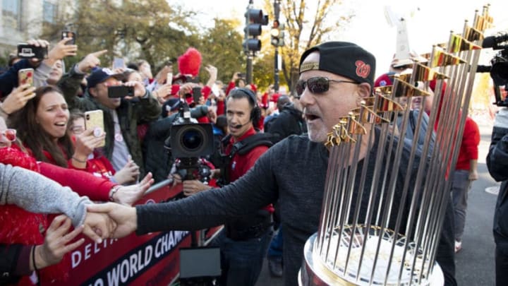 WASHINGTON, DC - NOVEMBER 02: Washington Nationals general manager Mike Rizzo holds the Commissioner's Trophy as he celebrates with fans during a parade to celebrate the Washington Nationals World Series victory over the Houston Astros on November 2, 2019 in Washington, DC. This is the first World Series win for the Nationals in 95 years. (Photo by Patrick McDermott/Getty Images)