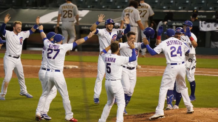 CHICAGO, ILLINOIS - AUGUST 02: Javier Baez #9 of the Chicago Cubs celebrates with teammates following his walk off RBI single during the eleventh inning against the Pittsburgh Pirates at Wrigley Field on August 02, 2020 in Chicago, Illinois. (Photo by Nuccio DiNuzzo/Getty Images)