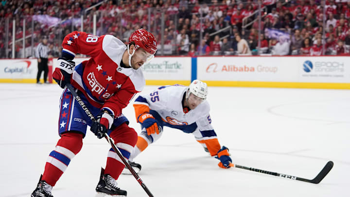 WASHINGTON, DC – APRIL 06: Chandler Stephenson #18 of the Washington Capitals skates with the puck against Johnny Boychuk #55 of the New York Islanders in the first period at Capital One Arena on April 6, 2019 in Washington, DC. (Photo by Patrick McDermott/NHLI via Getty Images)