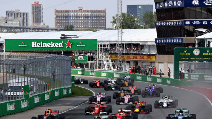 MONTREAL, QC - JUNE 11: Lewis Hamilton of Great Britain driving the (44) Mercedes AMG Petronas F1 Team Mercedes F1 WO8 leads Valtteri Bottas driving the (77) Mercedes AMG Petronas F1 Team Mercedes F1 WO8 Sebastian Vettel of Germany driving the (5) Scuderia Ferrari SF70H Max Verstappen of the Netherlands driving the (33) Red Bull Racing Red Bull-TAG Heuer RB13 TAG Heuer and the rest of the field towards the first corner during the Canadian Formula One Grand Prix at Circuit Gilles Villeneuve on June 11, 2017 in Montreal, Canada. (Photo by Mark Thompson/Getty Images)