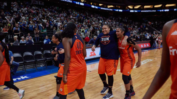 Members of the Connecticut Sun celebrate their fourth straight win at Xcel Energy Center. Photo by Abe Booker, III