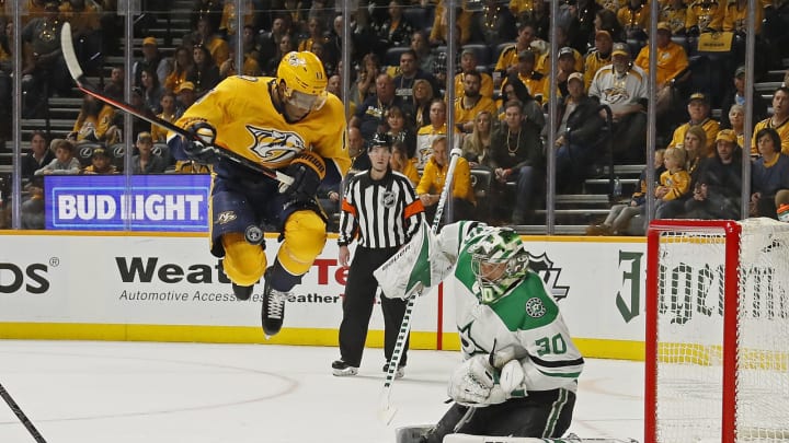 NASHVILLE, TENNESSEE – APRIL 13: Wayne Simmonds #17 of the Nashville Predators is hit by a puck while jumping in front of goalie Ben Bishop #30 of the Dallas Stars during the first period in Game Two of the Western Conference First Round during the 2019 NHL Stanley Cup Playoffs at Bridgestone Arena on April 13, 2019 in Nashville, Tennessee. (Photo by Frederick Breedon/Getty Images)