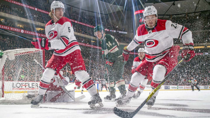 ST. PAUL, MN – MARCH 6: Brett Pesce #22 and Noah Hanifin #5 of the Carolina Hurricanes skate to the puck against the Minnesota Wild during the game at the Xcel Energy Center on March 6, 2018 in St. Paul, Minnesota. (Photo by Bruce Kluckhohn/NHLI via Getty Images)