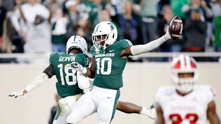 EAST LANSING, MI – SEPTEMBER 28: Michael Dowell #10 and Kalon Gervin #18 of the Michigan State Spartans celebrate during a game against the Indiana Hoosiers at Spartan Stadium on September 28, 2019 in East Lansing, Michigan. Michigan State defeated Indiana 40-31. (Photo by Joe Robbins/Getty Images)